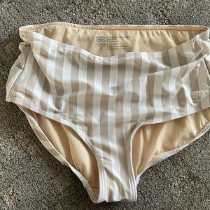 Tan and white Albion swim bottom